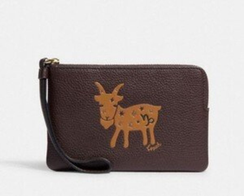 COACH GOAT mini wristlet retail 108.00